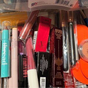Assorted Lippies, eyeshadow crayons, mascaras, eye liners, makeup brushes